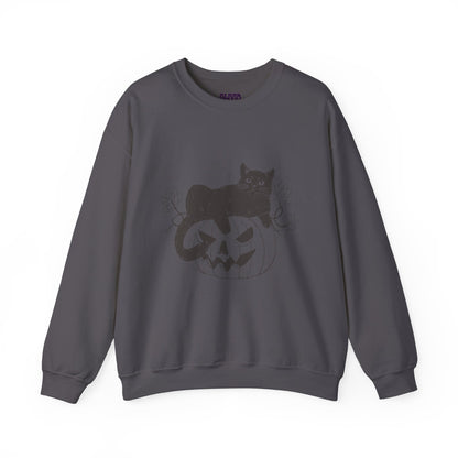 The PUMPKIN CAT SWEATSHIRT is ideal for Halloween lovers, showcasing a black cat perched on a carved pumpkin with a jack-o-lantern face. This dark gray sweatshirt features a subtle design accented by small branches and is set against a plain white backdrop, emphasizing its Cats and Halloween theme.